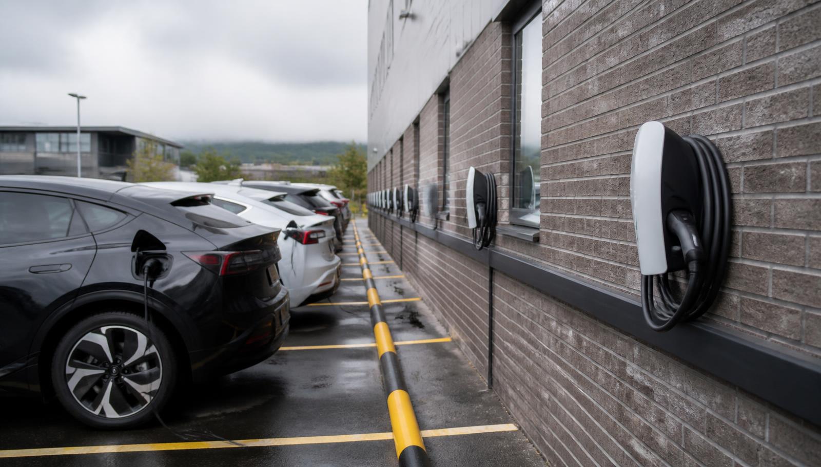 Row of commercial EV charge points in a business car park